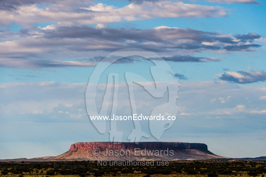 Mount Conner, a flat-topped inselberg rises from the desert plain. Mount Conner, Northern Territory, Australia