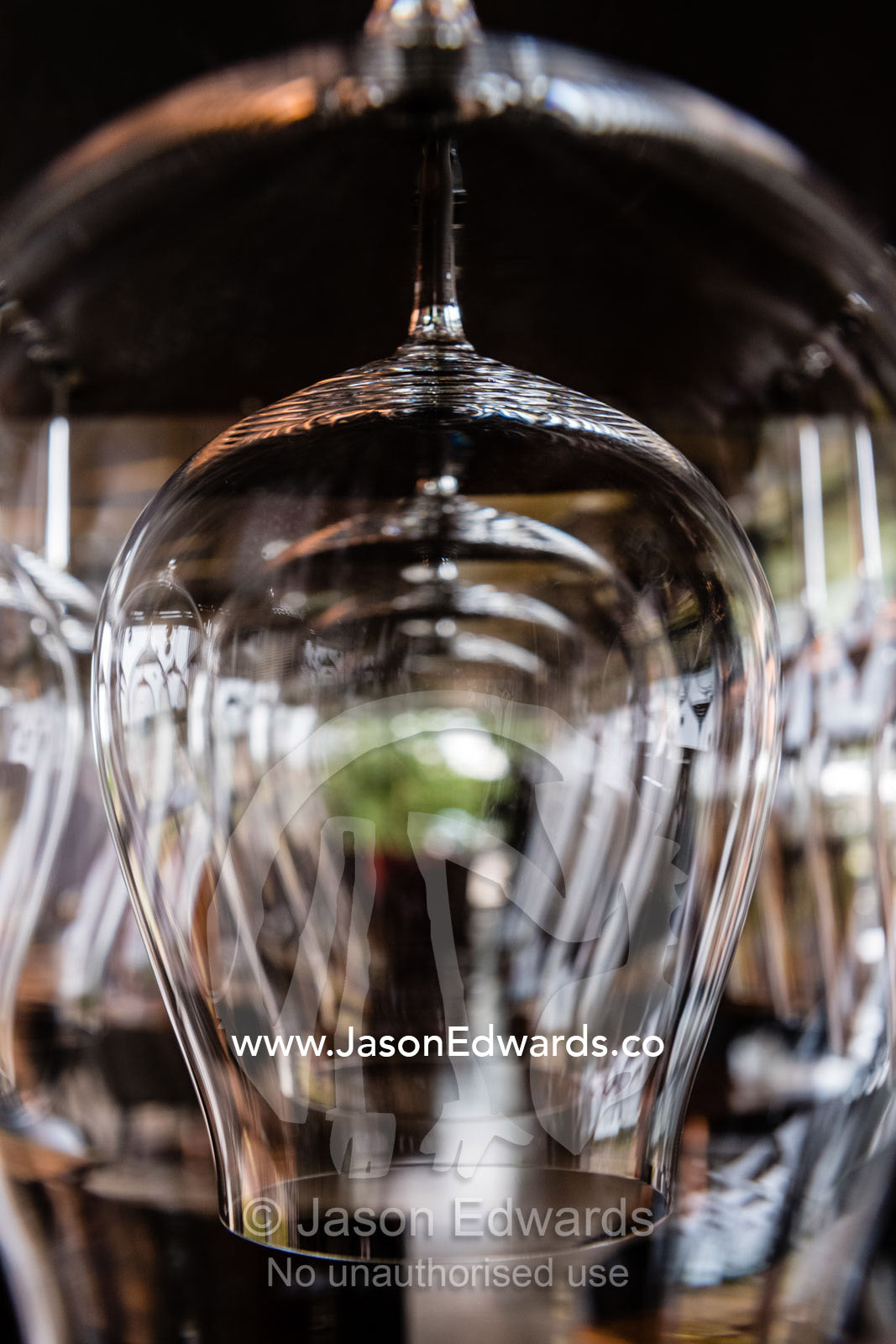 Rows of wine glasses hanging in a restaurant bar. Rosslyn Park, Adelaide, South Australia, Australia