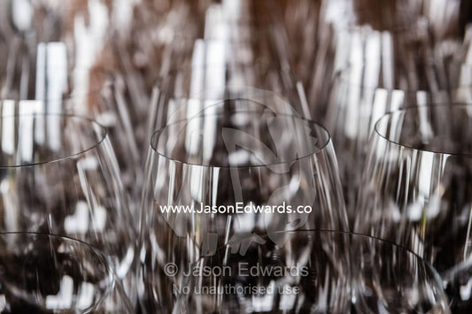 The transparent glass rims of wine glasses stored in a restaurant. Rosslyn Park, Adelaide, South Australia, Australia