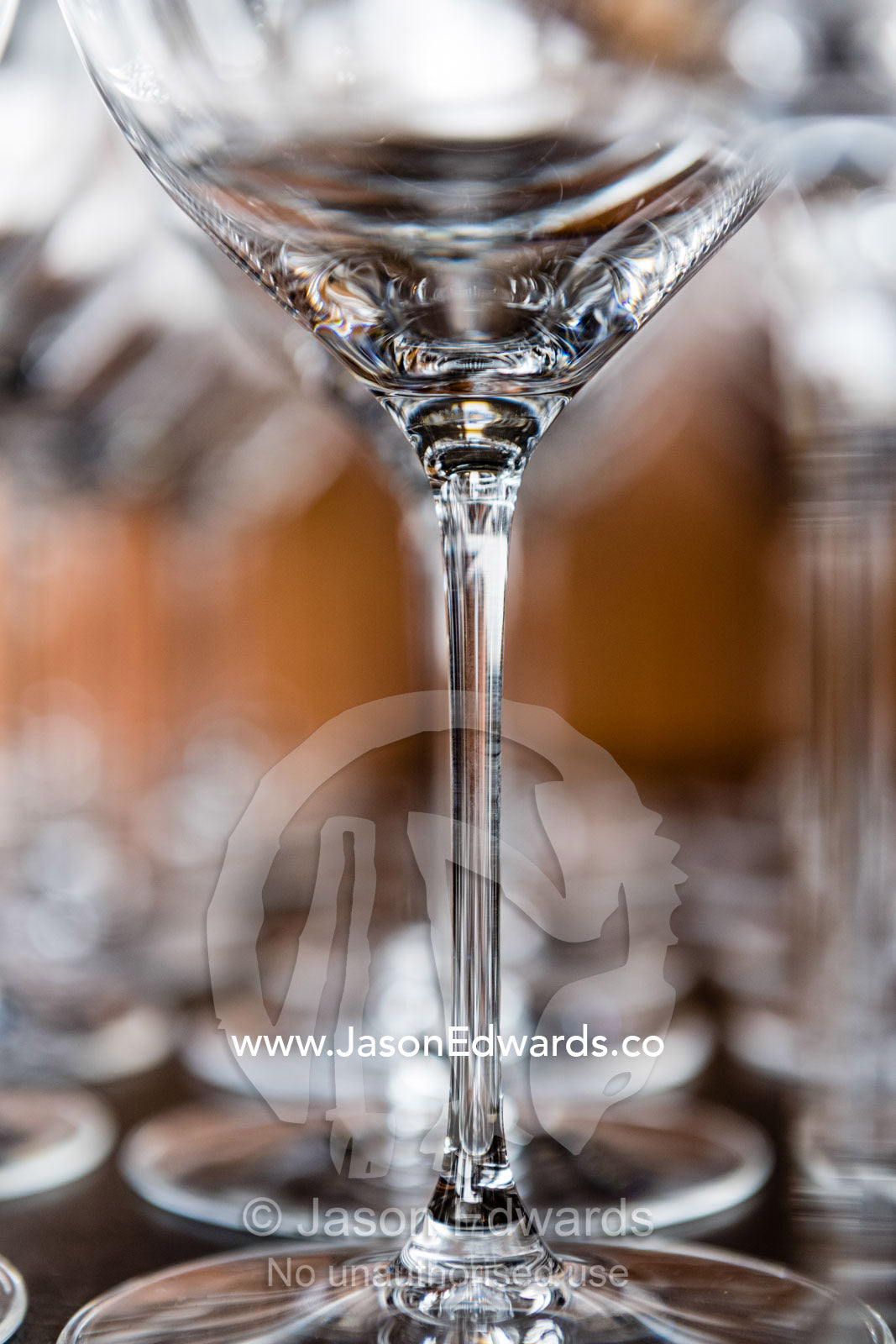The transparent glass stems of wine glasses stored in a restaurant. Rosslyn Park, Adelaide, South Australia, Australia