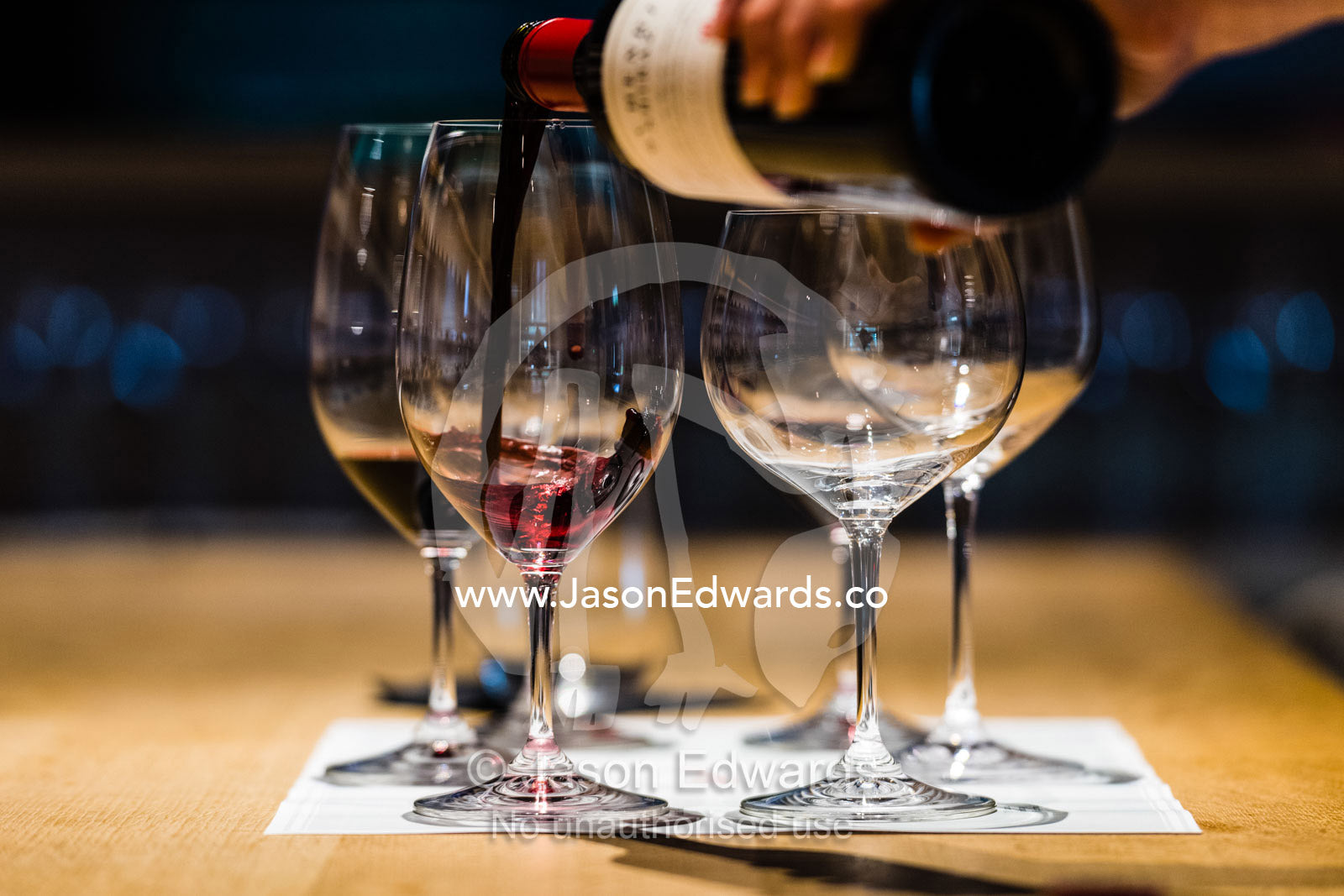 Pouring samples for red wine for a wine tasting. Rosslyn Park, Adelaide, South Australia, Australia