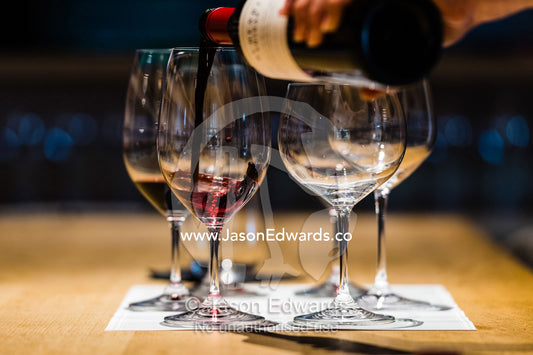 Pouring samples for red wine for a wine tasting. Rosslyn Park, Adelaide, South Australia, Australia