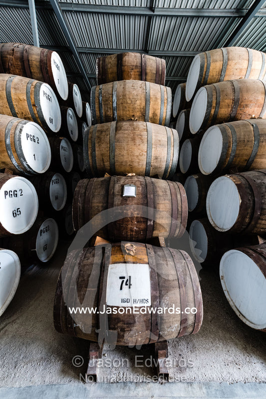 An enormous collection of wine barrels stacked and stored in a shed to age and mature. Nuriootpa, South Australia, Australia