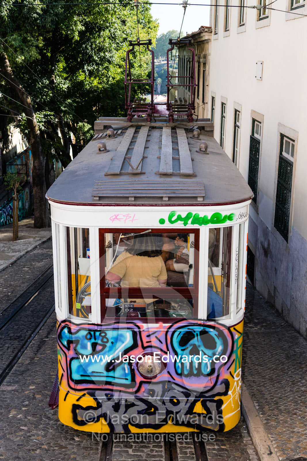 The Gloria Funicular is a funicular railway line that transports passengers up and down steep hills. Lisbon, Portugal