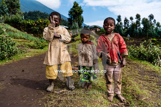 Village boys live in small communities on the slopes of volcanic mountains working the fields to grow crops. Ruhengeri, Rwanda