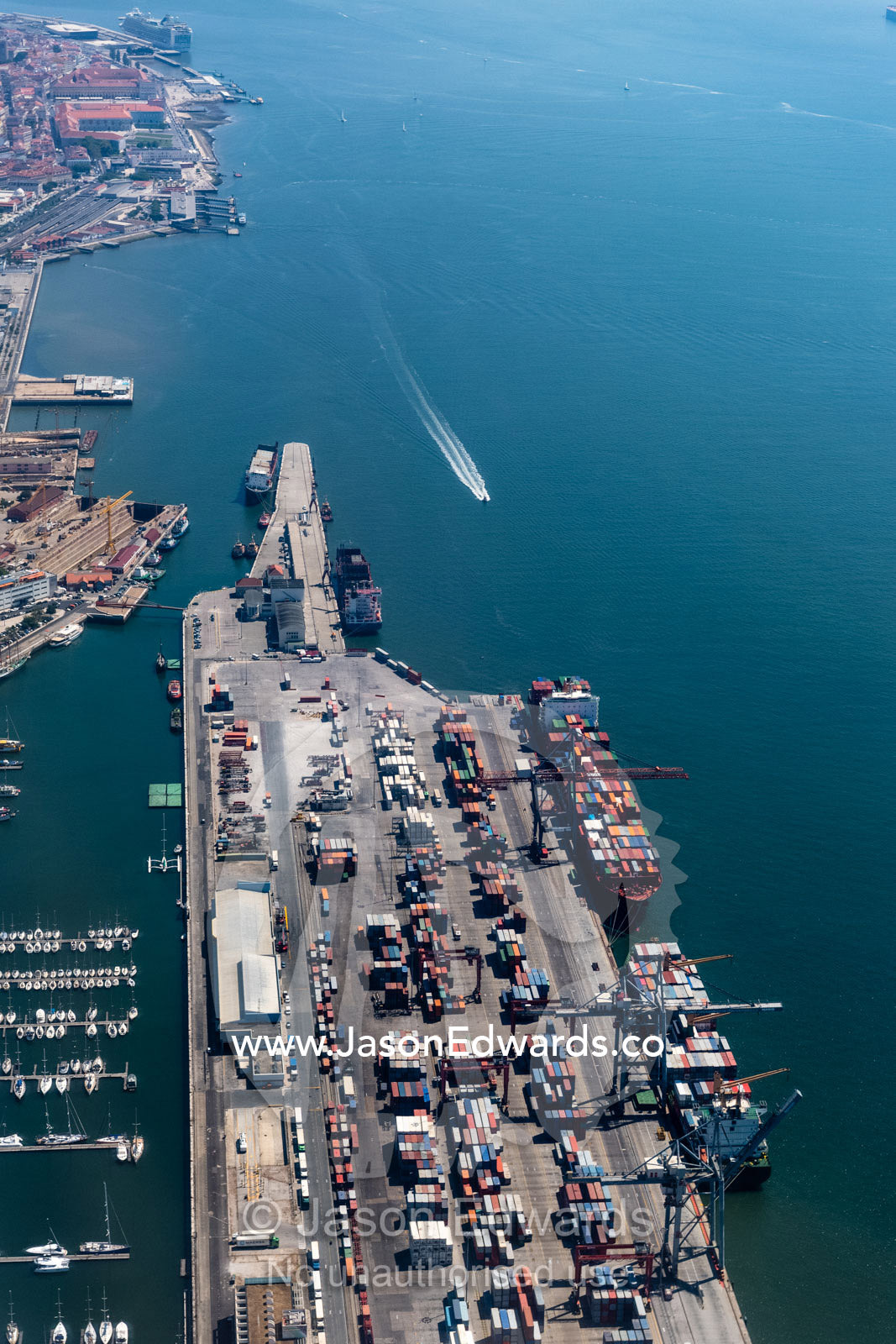 An aerial view of container ships loading cargo on the Targus River in Lisbon. Lisbon, Lisboa, Portugal