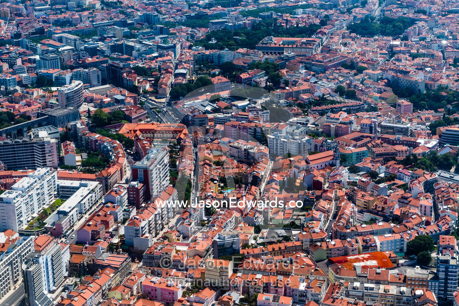 An aerial view of terracotta tile roofs in the suburbs of Lisbon on the Targus River. Lisbon, Lisboa, Portugal