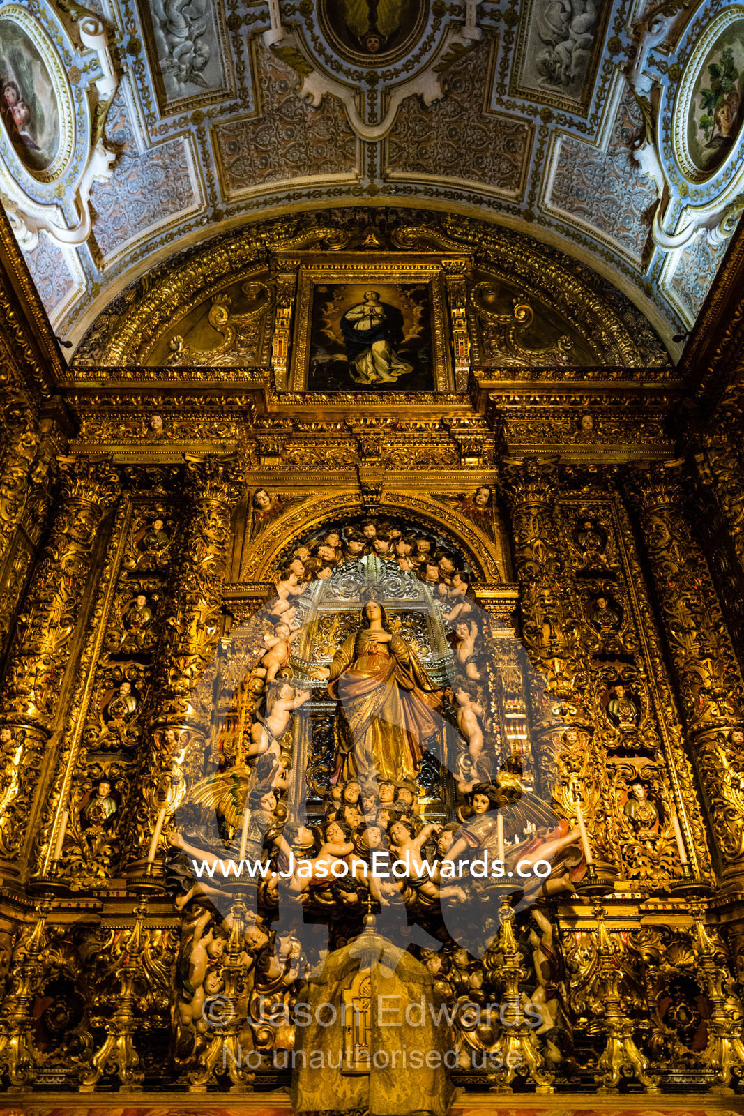 Ornate gold filigree and iconography of the Christian faith in the Roman Catholic Church Igreja de Sao Roque, Church of Saint Roch. Lisbon, Lisboa, Portugal