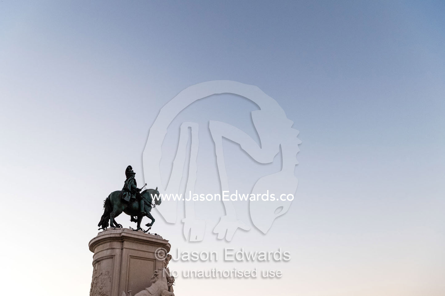 A bronze Statue of King John I rising into a clear blue pre-dawn sky. Lisbon, Lisboa, Portugal