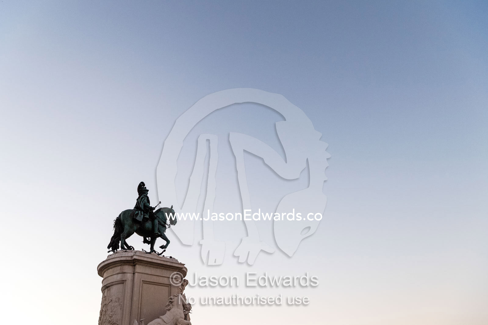 A bronze Statue of King John I rising into a clear blue pre-dawn sky. Lisbon, Lisboa, Portugal