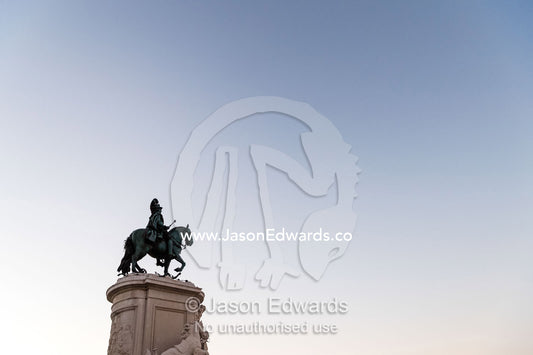 A bronze Statue of King John I rising into a clear blue pre-dawn sky. Lisbon, Lisboa, Portugal