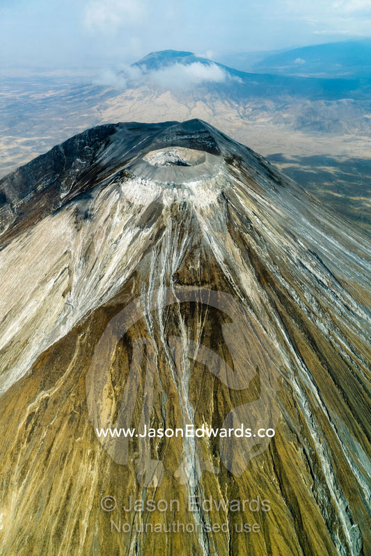 Erosion carves valleys into ash and lava flows on the slopes of a primeval volcano caldera. Crater Highlands, Ngorongoro Hig, African Rift Valley , Serengeti National Park, Tanzania