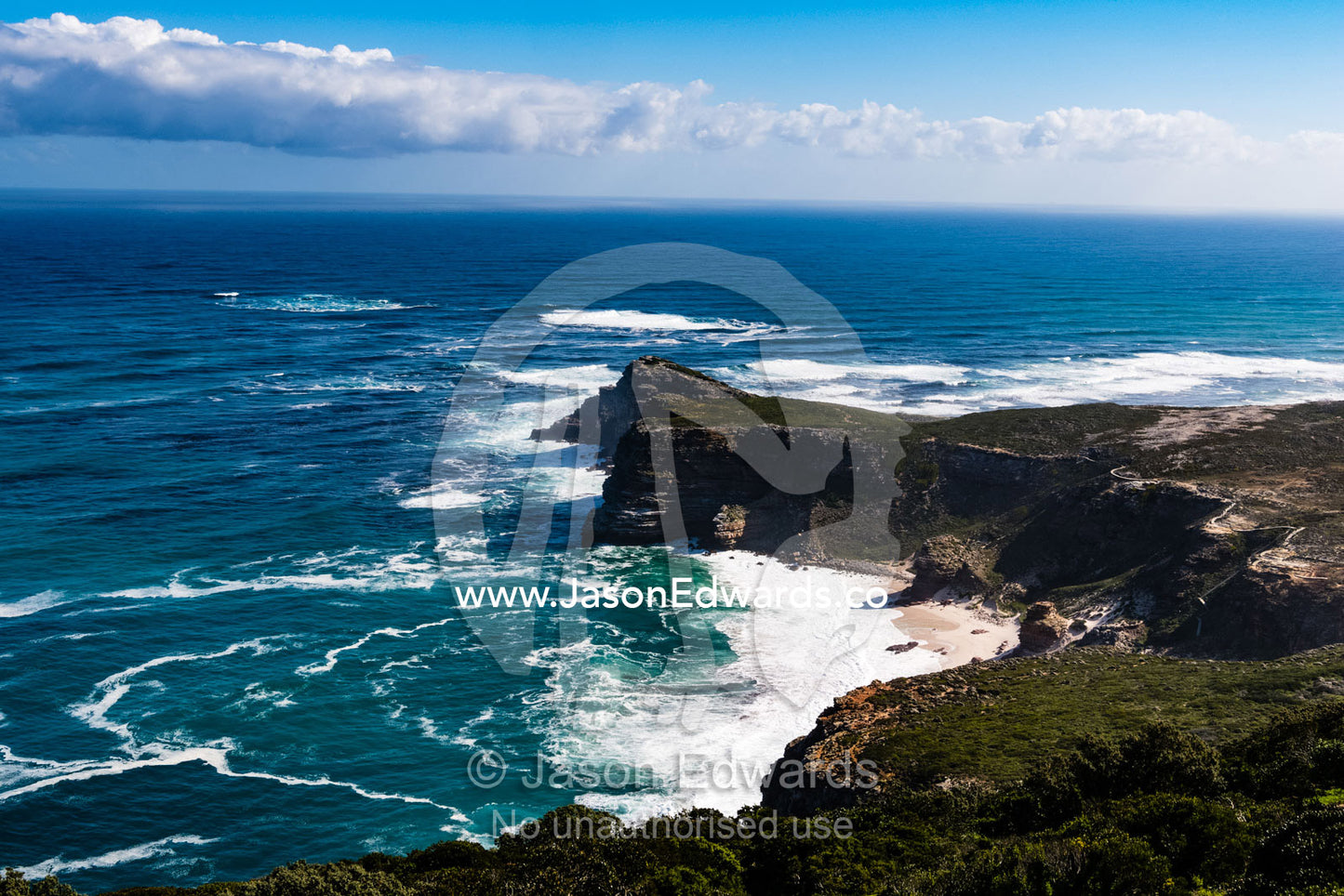 Treacherous ocean currents circulate around the Cape of Good Hope peninsula transporting nutrient foam. Cape Point National Park, South Africa