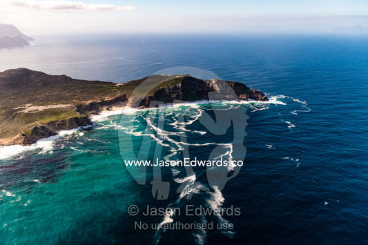 An aerial view of treacherous ocean currents circulating around the Cape of Good Hope transporting nutrient foam. Cape Point National Park, South Africa