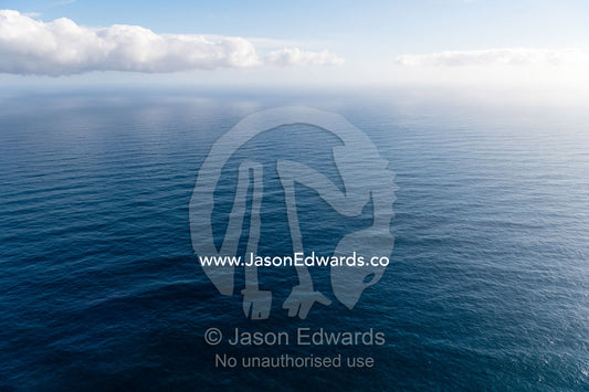 An aerial view of a wide ocean off the Cape of Good Hope. Cape Point National Park, South Africa