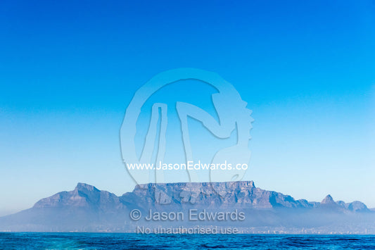 Table Mountain rises above the sea mist in Table Bay. Table Mountain National Park, South Africa