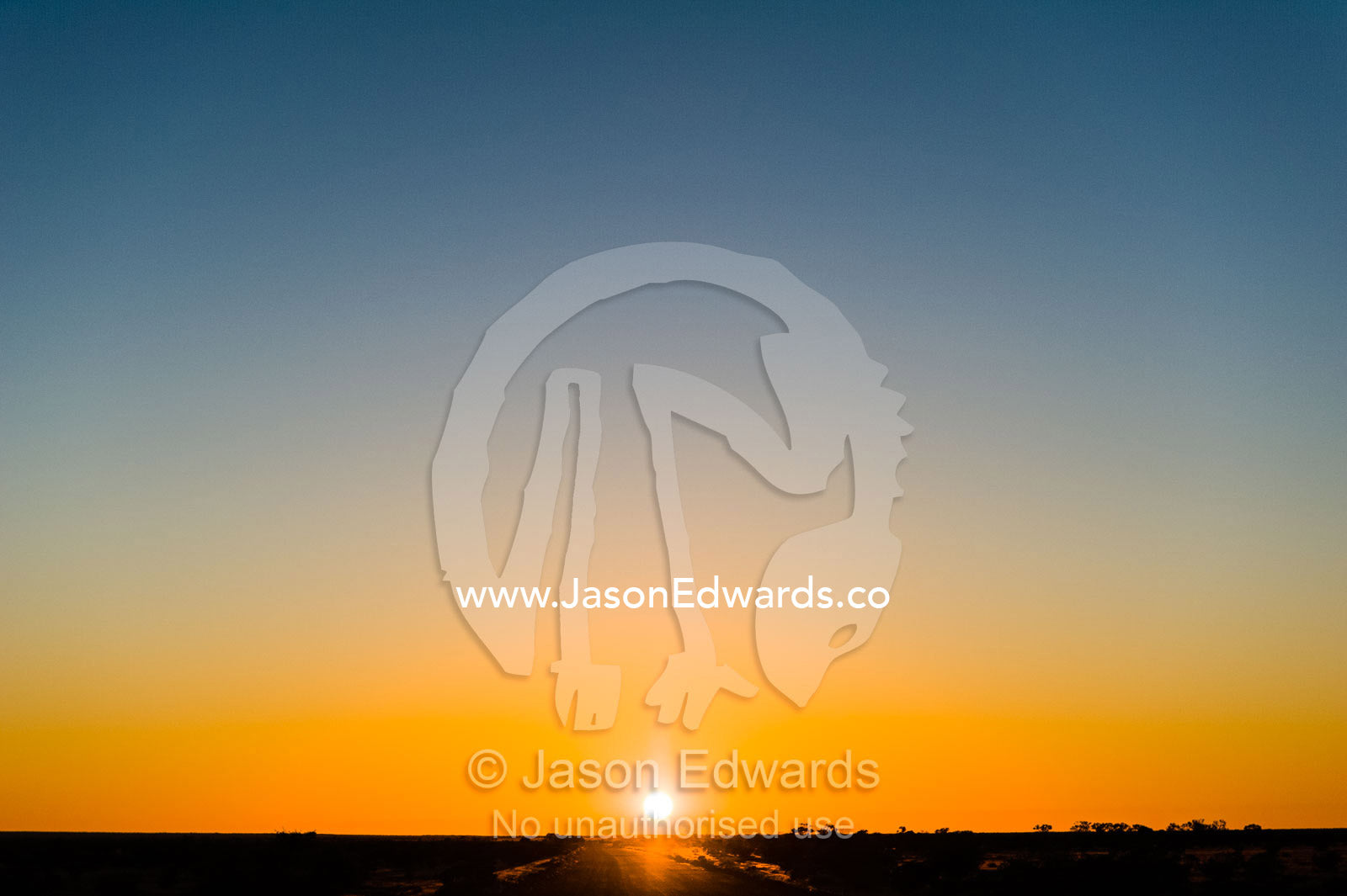 Sunset over the a vast desert plain in the outback. Coober Pedy, South Australia, Australia