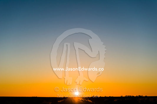 Sunset over the a vast desert plain in the outback. Coober Pedy, South Australia, Australia