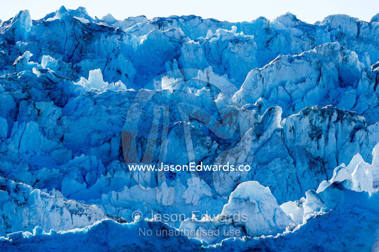 Crevasses and pressure ridges at the terminus fracture zone of a glacier. Rolinge Glacier, Rode Fjord, Scoresby Sound, Greenland
