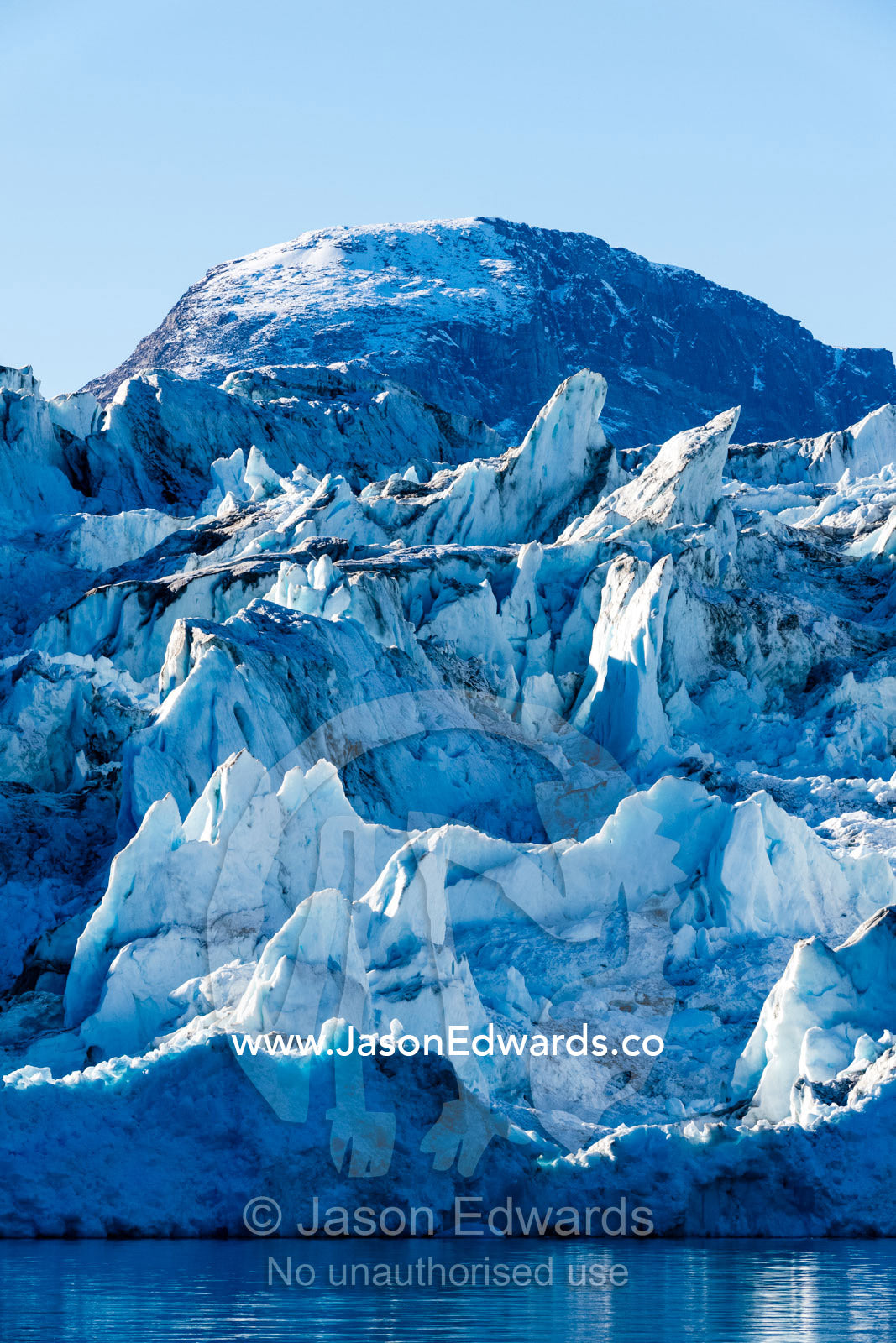 Crevasses and pressure ridges at the terminus fracture zone of a glacier. Rolinge Glacier, Rode Fjord, Scoresby Sound, Greenland