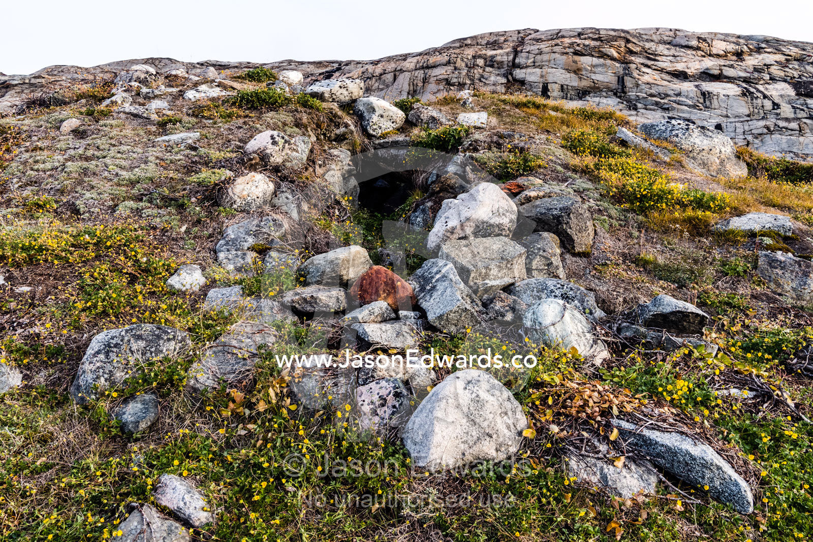 An ancient Thule underground home and doorway constructed of large stones. Denmark Island, Hekla Havn, Scoresby Sound, Greenland