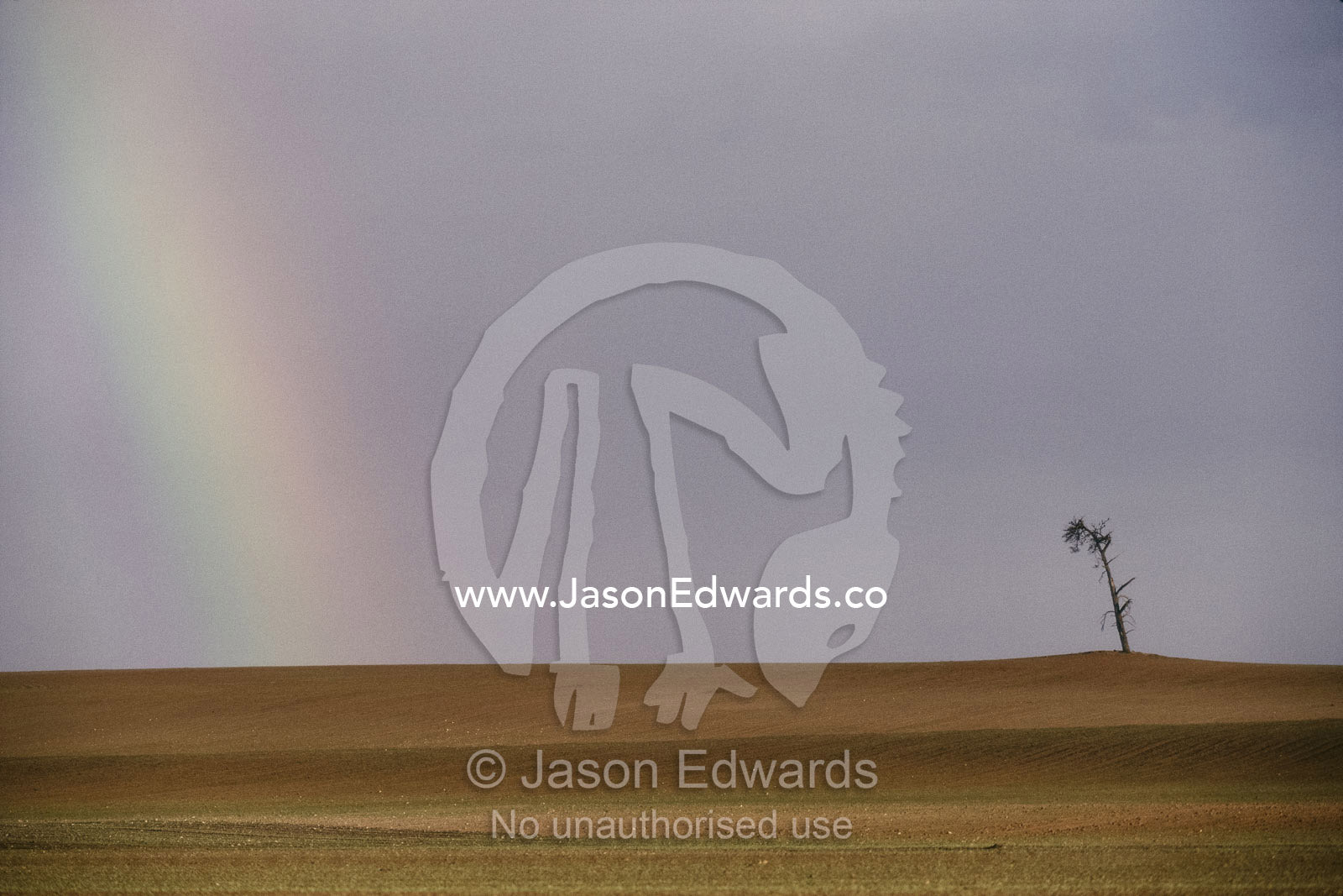 A rainbow over a drought-striken landscape in northwestern Victoria. Northwestern Victoria, Australia.