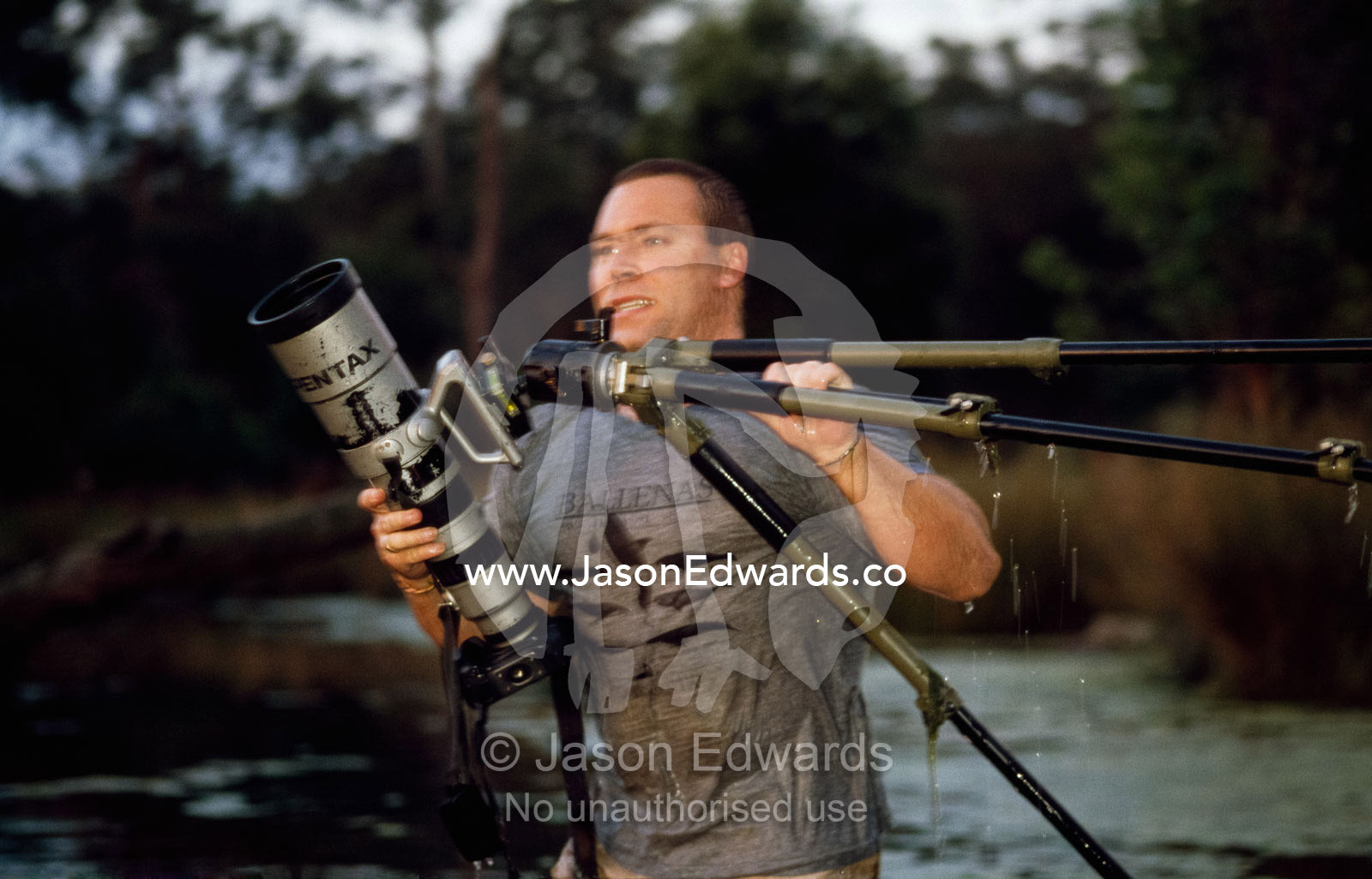Jason Edwards photographing in wetlands. Corrandurk Wetlands, Victoria, Australia.