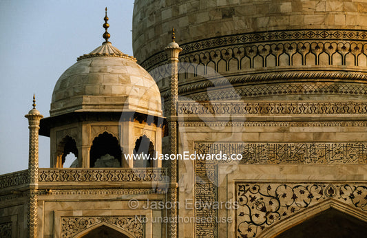 Marble domes and pietra dura inlay adorn the Taj Mahal. Taj Mahal, Agra, India.
