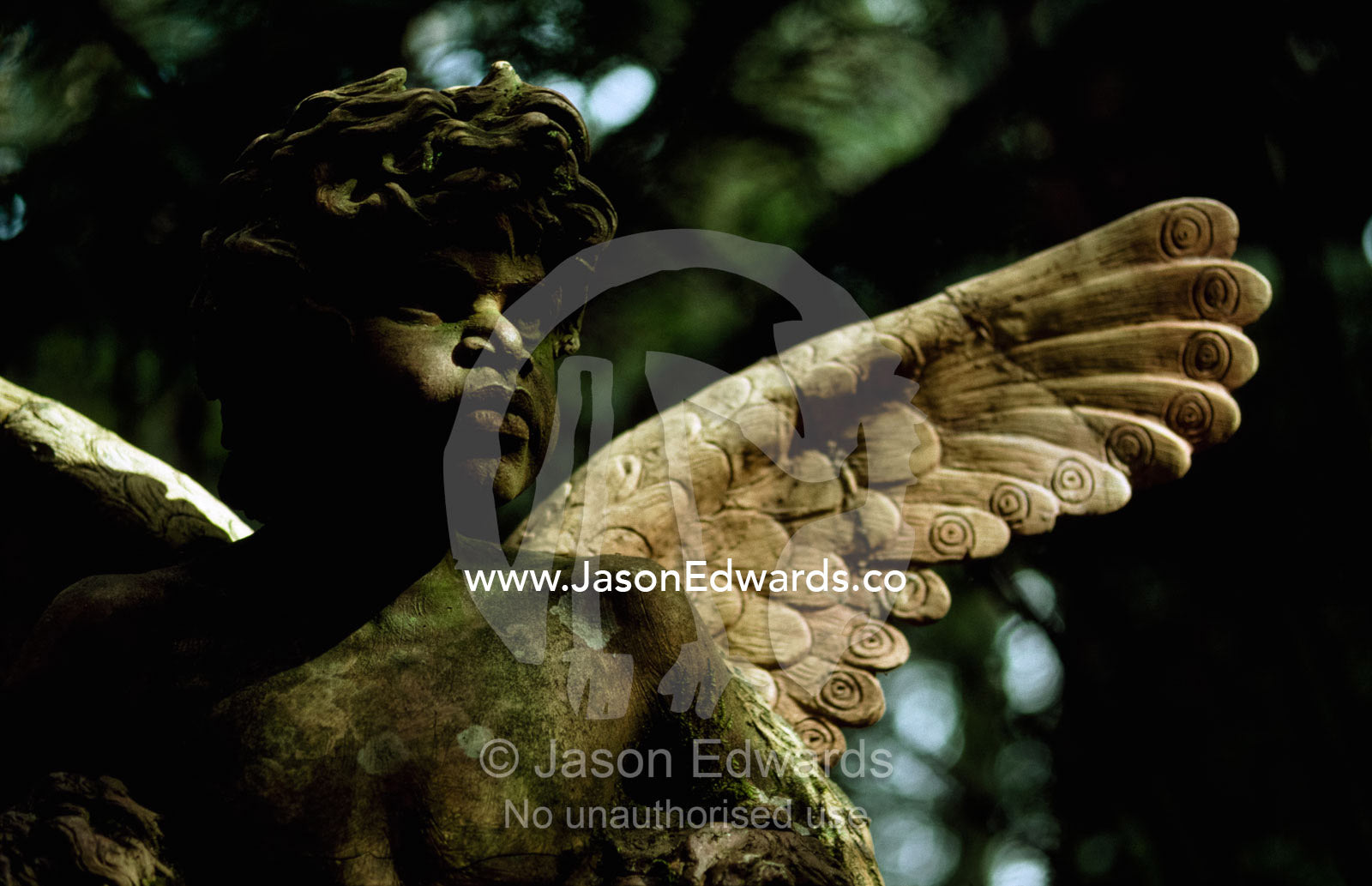 Sculpture of an Aboriginal angel in wooded William Ricketts Sanctuary. William Ricketts Sanctuary, Victoria, Australia.