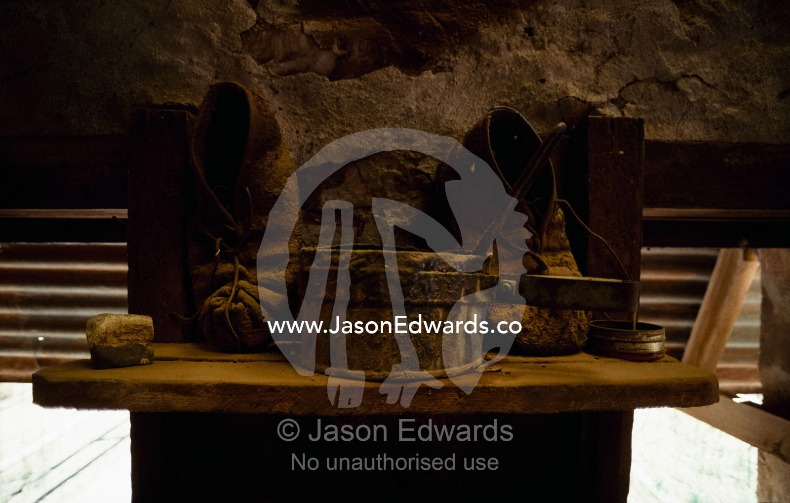 An antique pot and shearing slippers in an abandoned shearing shed. Nilpena Station, South Australia, Australia.