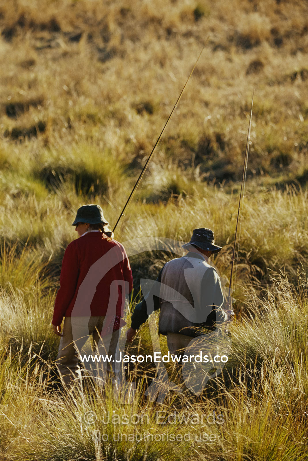 A father and daughter fly fish together. Alpine National Park, Victoria, Australia.