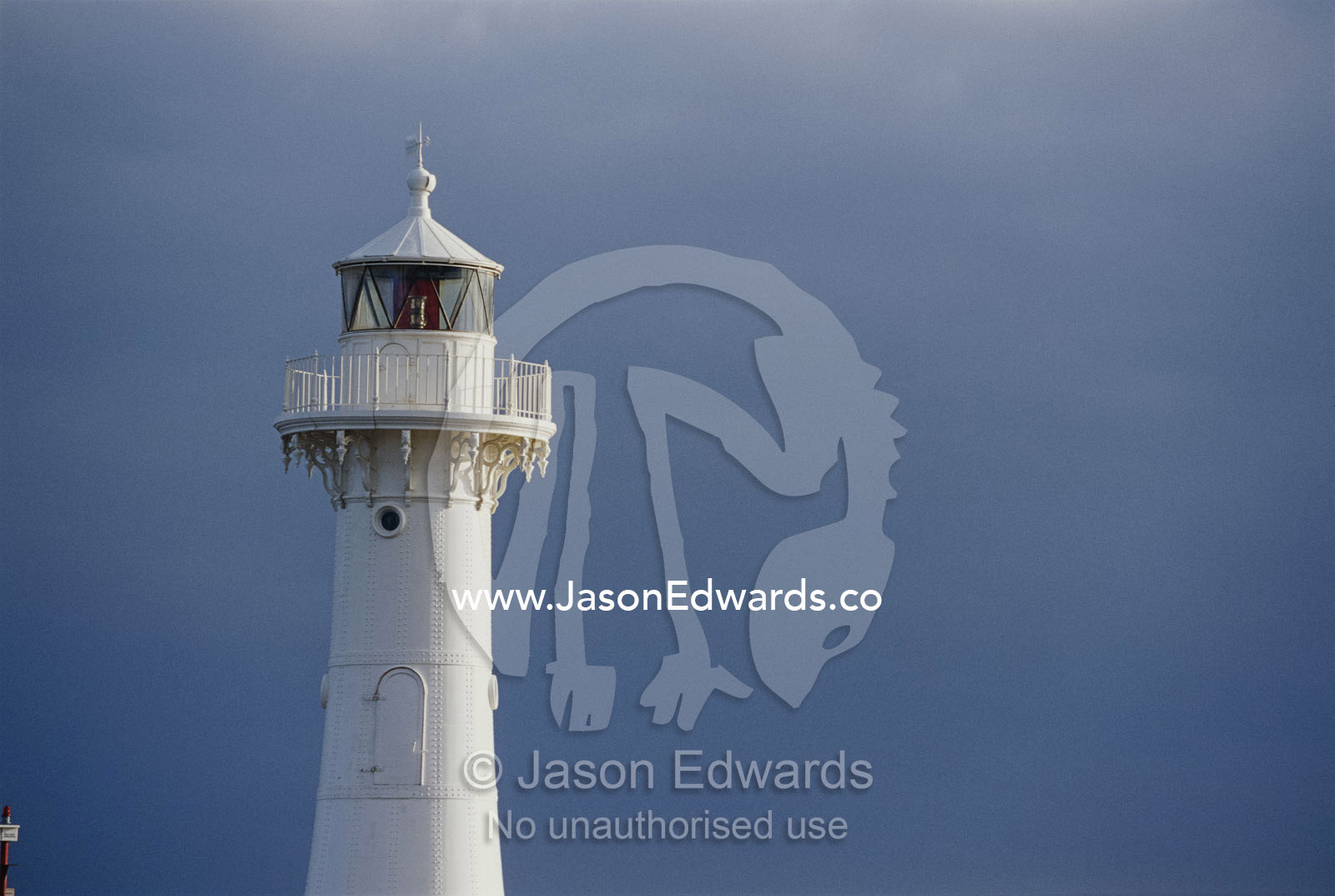 Lighthouse against a dark sky. Wollongong, New South Wales, Australia.