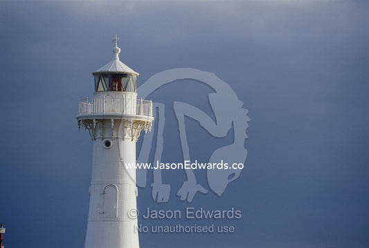 Lighthouse against a dark sky. Wollongong, New South Wales, Australia.