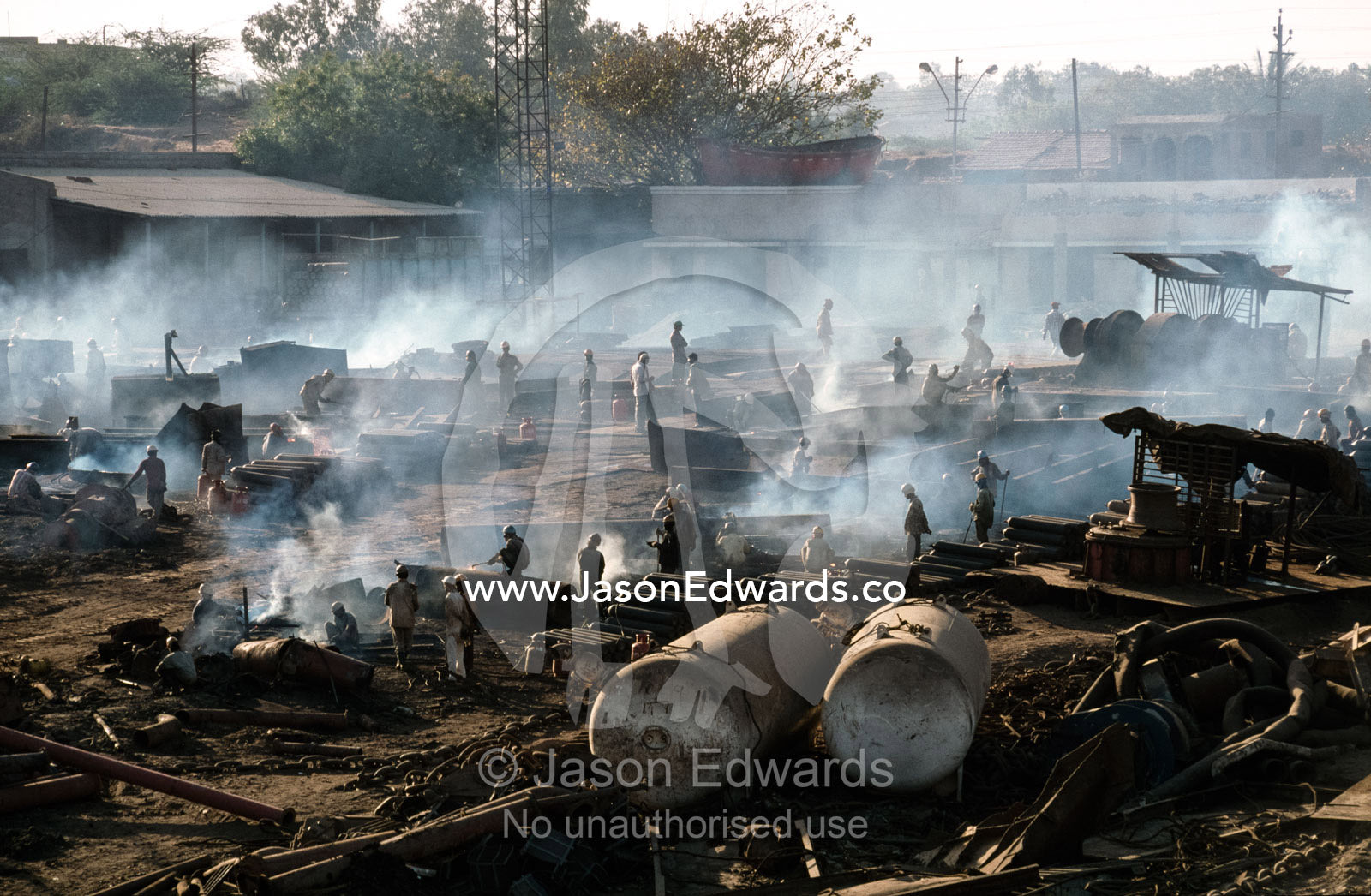 Cutters labor in a world of acrid smoke and explosive gases. Alang, India.