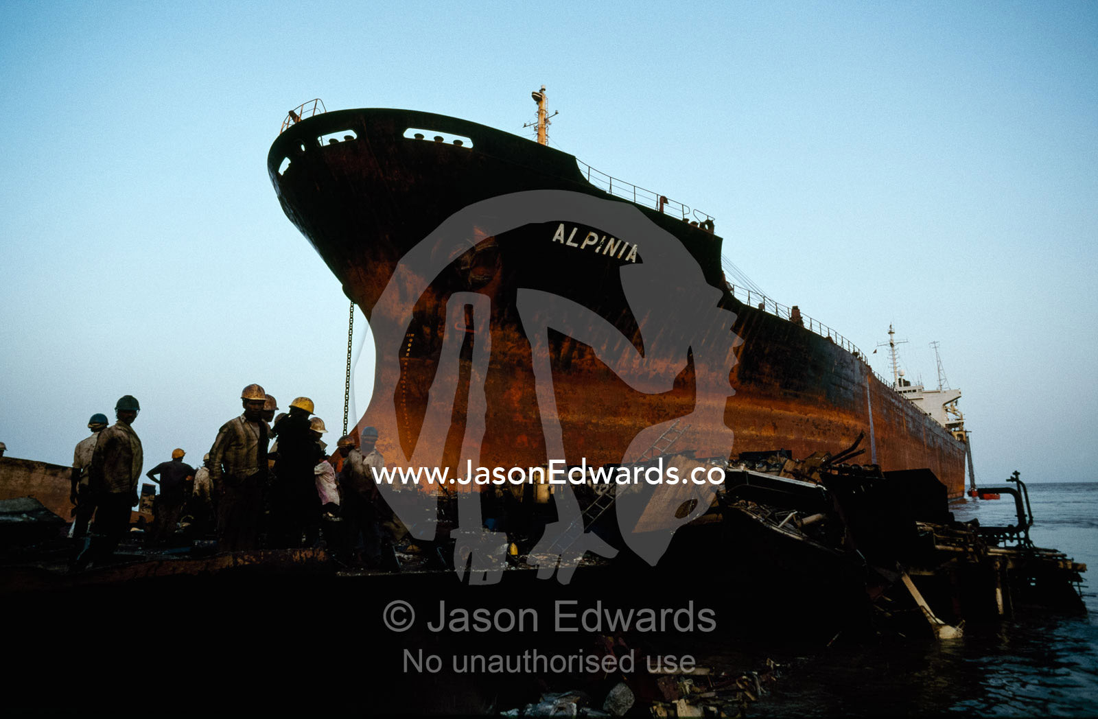 After the beaching of a ship, workers await the crew's disembarkation. Alang, India.