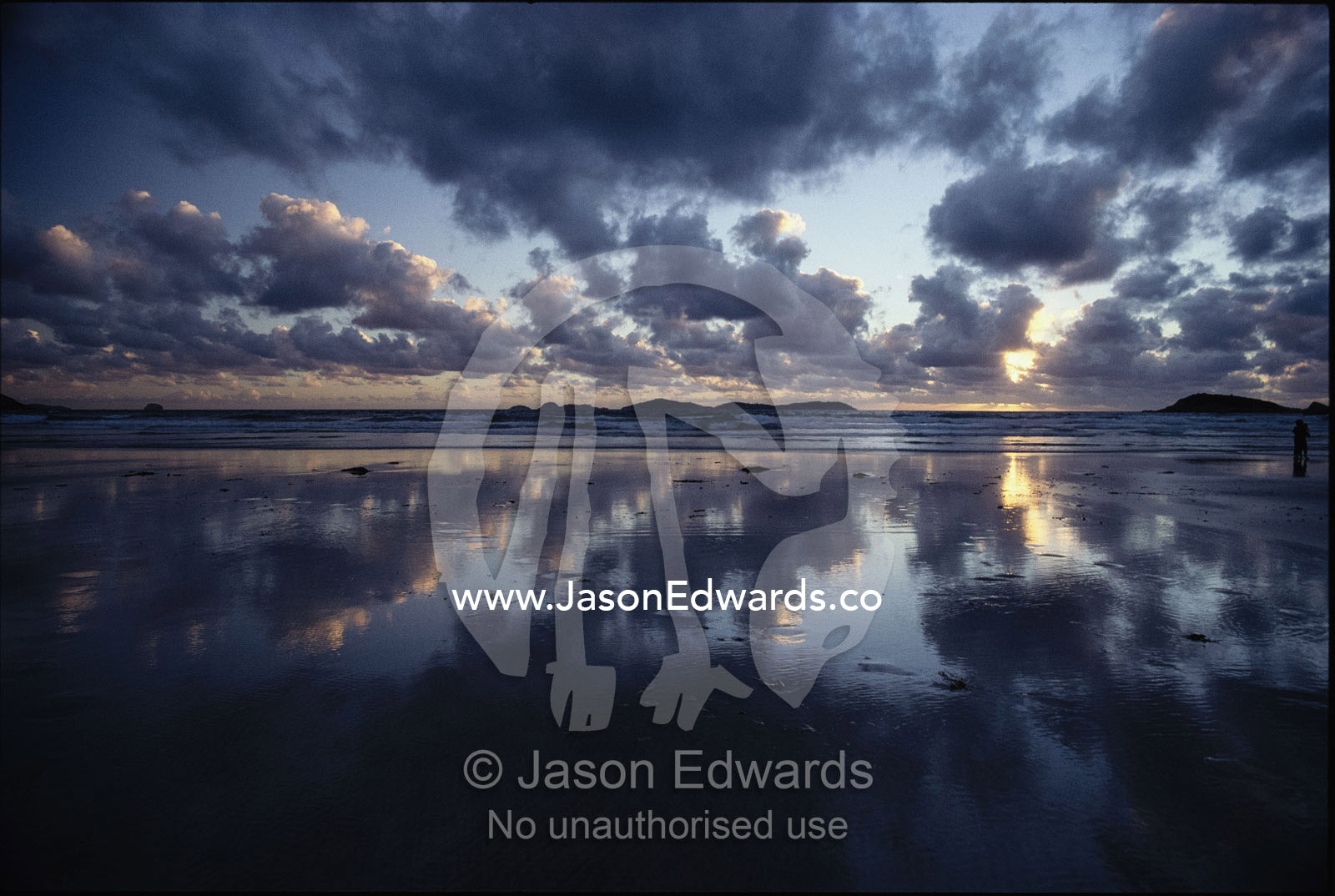 Storm clouds over tidal flat with reflection. Wilsons Promontory National Park, Victoria, Australia.