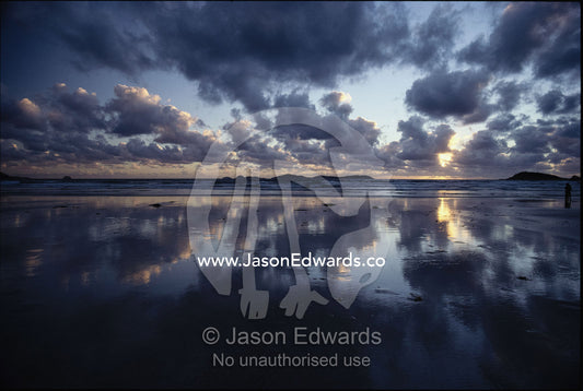 Storm clouds over tidal flat with reflection. Wilsons Promontory National Park, Victoria, Australia.