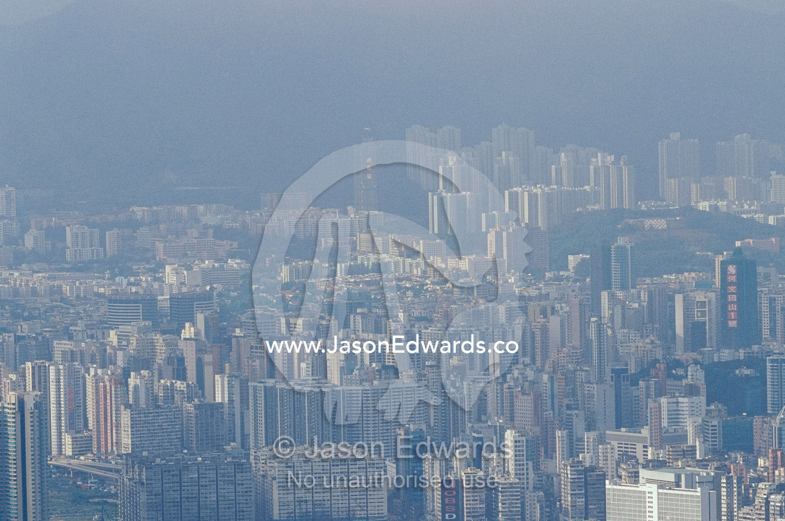 A view of Kowloon shrouded with air pollution. Kowloon, Hong Kong.