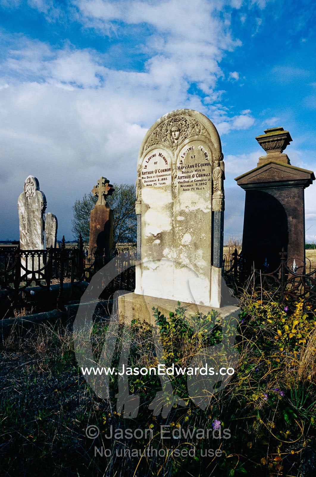 An old cemetery under storm clouds. Cressy, Tasmania, Australia.