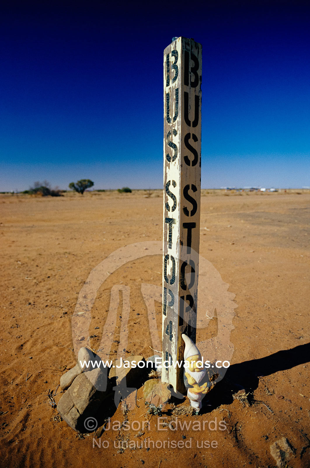 A garden gnome at a bus stop in an Outback desert town. William Creek, South Australia.