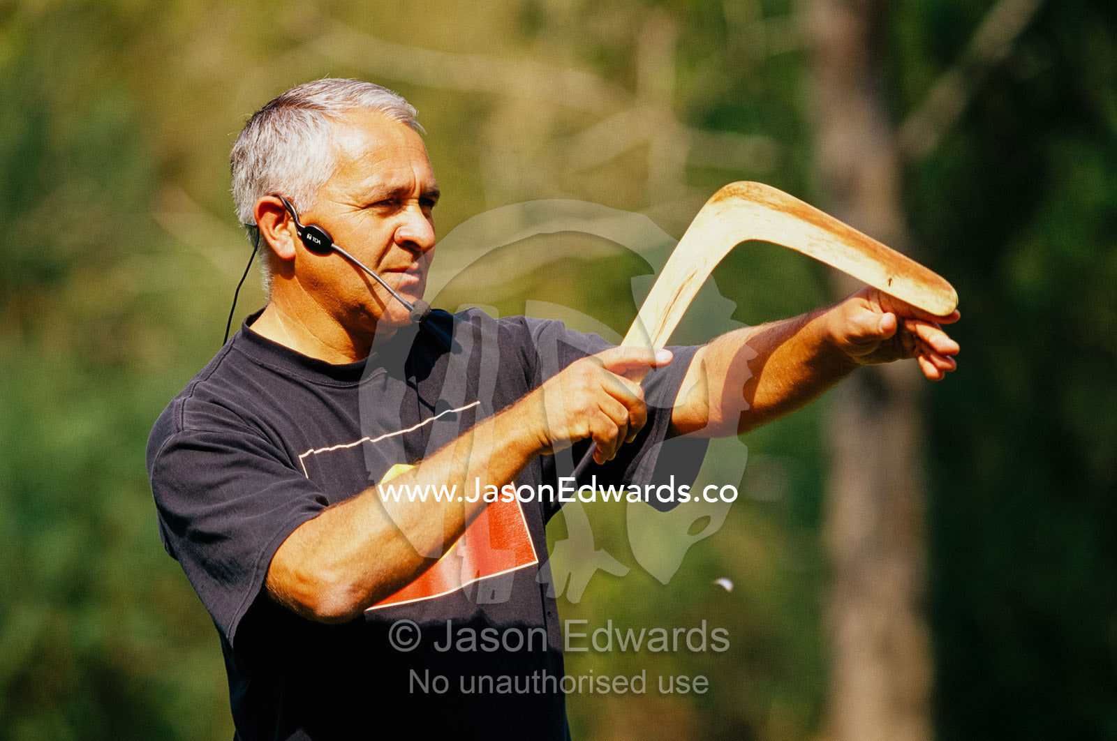 An Aboriginal guide teaching how to throw a boomerang. Healesville Sanctuary, Victoria, Australia.