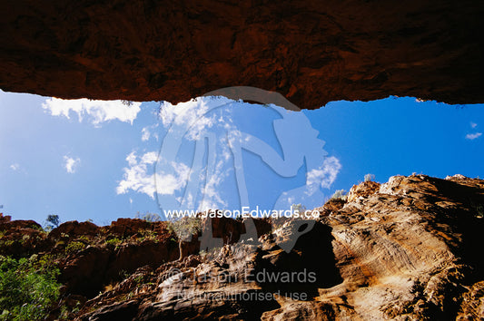 Gorge wall skyline with view to blue sky. Simpsons Cap, Northern Territory, Australia.