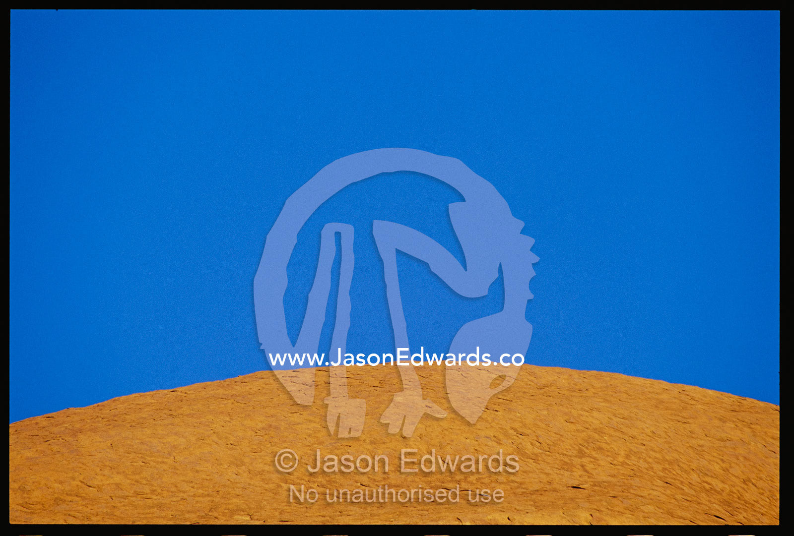Abstract of a rock formation under a blue sky. Uluru National Park, Northern Territory, Australia.