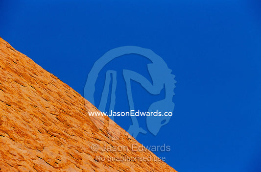 Abstract of a rock formation under a blue sky. Uluru National Park, Northern Territory, Australia.
