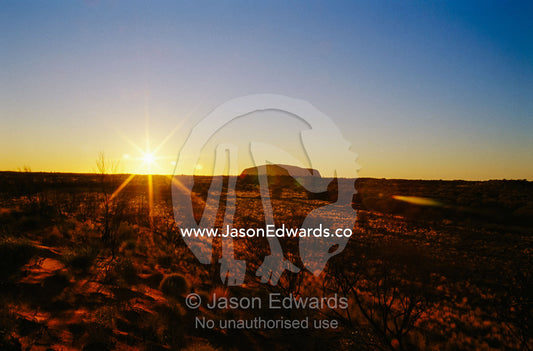 A view of Ayers Rock at sunset. Ayers Rock, Uluru National Park, Northern Territory, Australia.