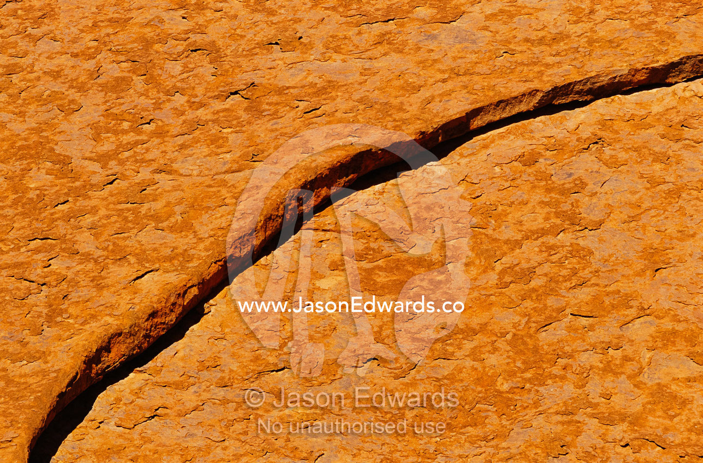 A close view of a crack in a rock formation in Uluru National Park. Uluru National Park, Northern Territory, Australia.