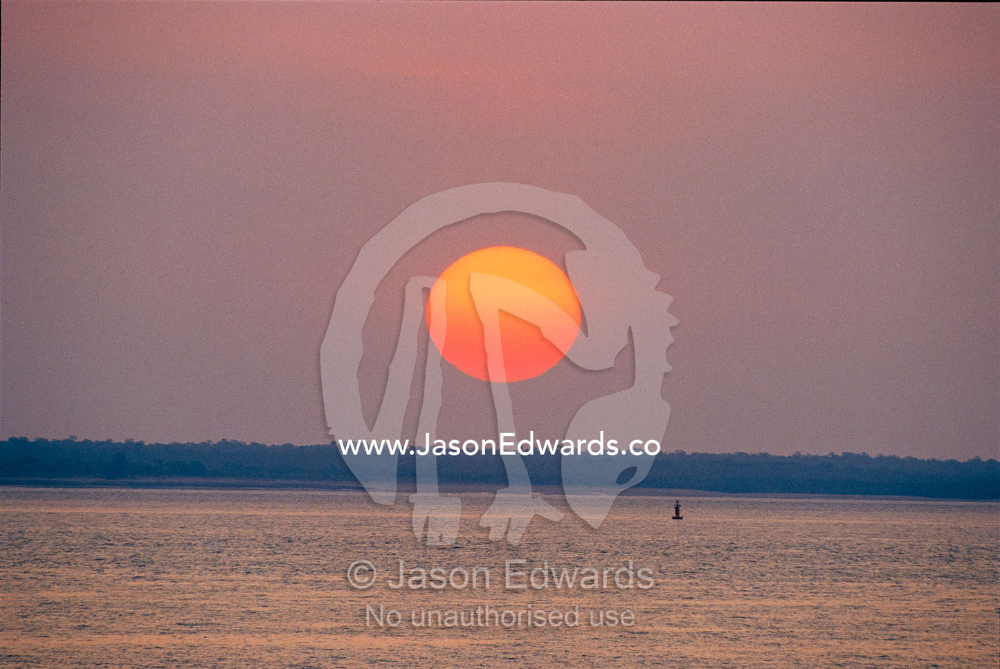 Sunset over the tranquil Beagle Gulf. Beagle Gulf, Darwin, Northern Territory, Australia.