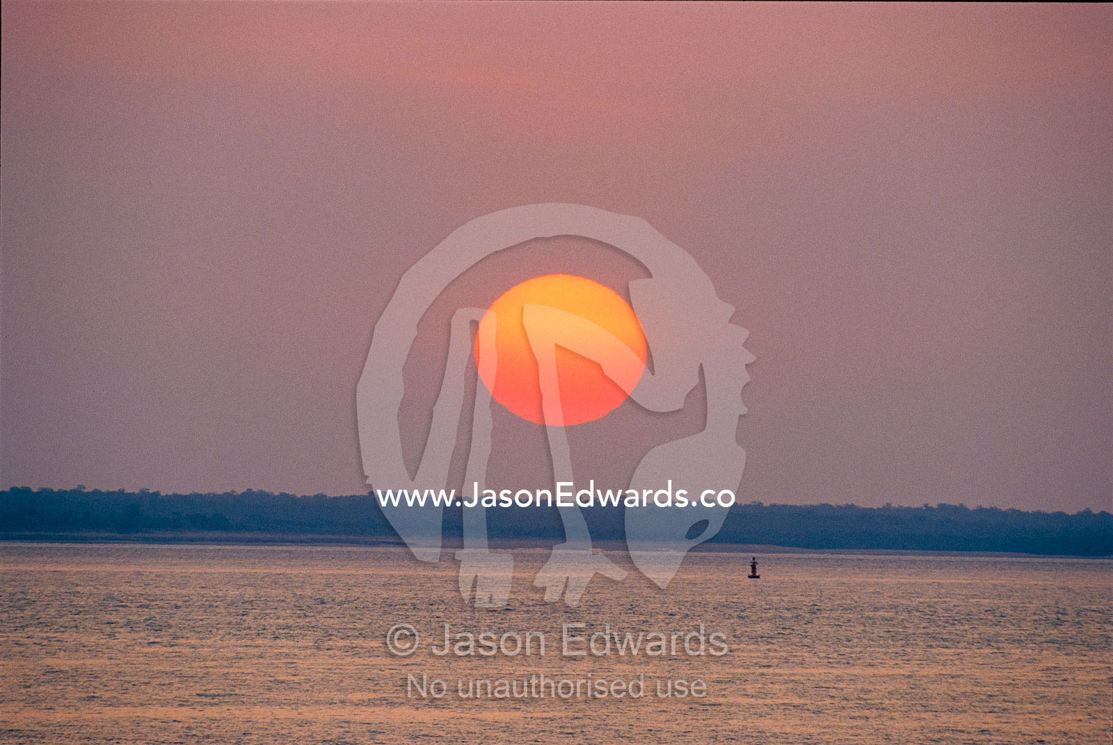 Sunset over the tranquil Beagle Gulf. Beagle Gulf, Darwin, Northern Territory, Australia.