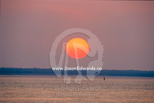 Sunset over the tranquil Beagle Gulf. Beagle Gulf, Darwin, Northern Territory, Australia.