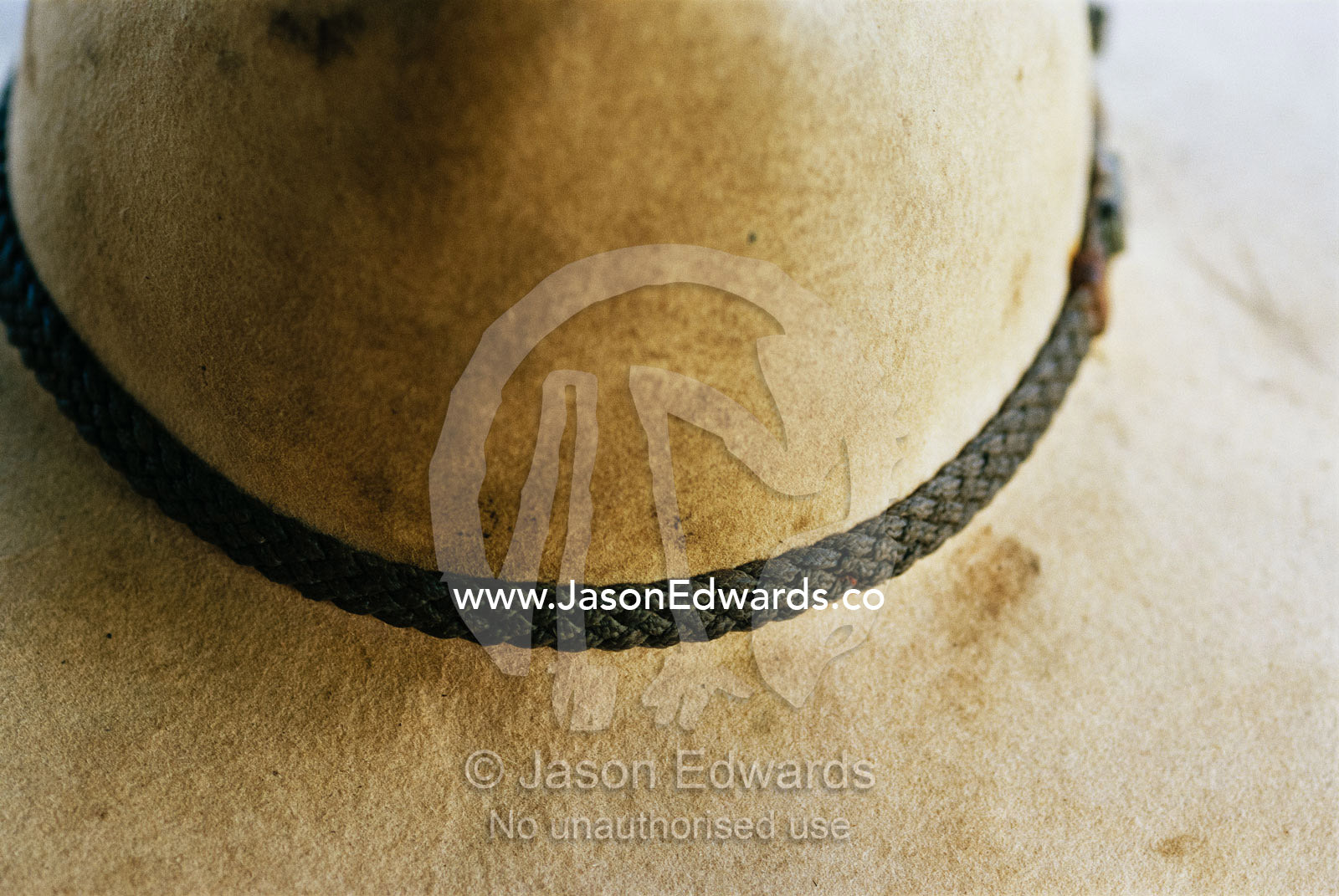Close view detail of the hat band on a dirty cowboy hat. Australia.